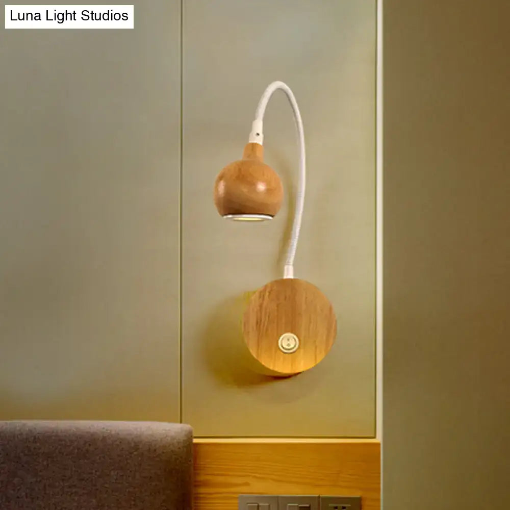 White wood reading nook sconce wall-mounted with curved white gooseneck and two wood spheres on Tampa Home & Garden Store