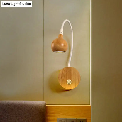 White wood reading nook sconce wall-mounted with curved white gooseneck and two wood spheres on Tampa Home & Garden Store