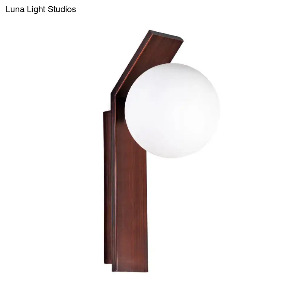 Milk Glass Wall Sconce by Decorbites; dark wood backplate with round white glass globe on Tampa Home & Garden Store
