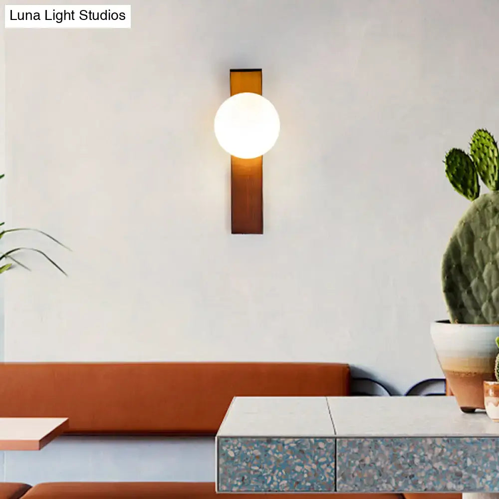 Milk Glass Wall Sconce with white globe on amber wood backplate by Decorbites on Tampa Home & Garden Store
