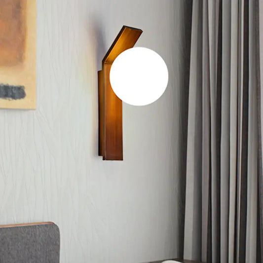 Milk Glass Wall Sconce with amber wood backplate and round white glass globe on Tampa Home & Garden Store