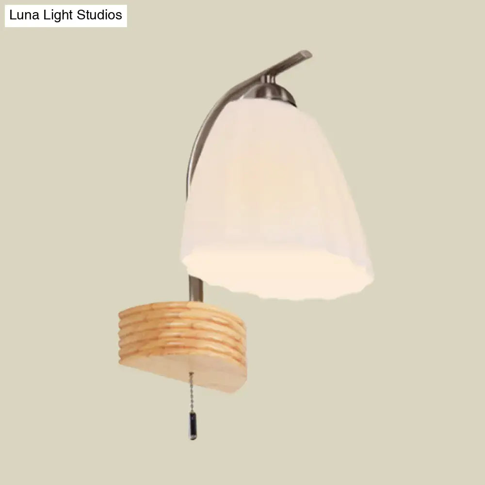 Ribbed Glass Wall Sconce with curved metal arm, frosted bell shade and pull chain on Tampa Home & Garden Store