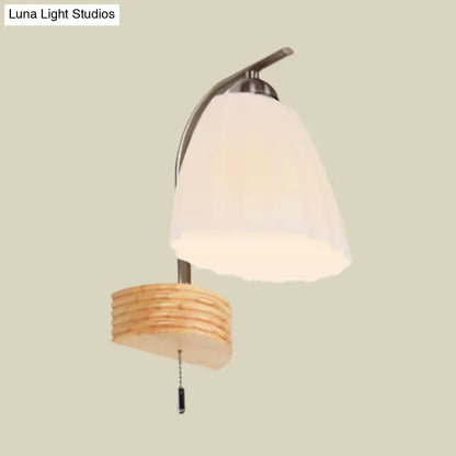 Ribbed Glass Wall Sconce with curved metal arm, frosted bell shade and pull chain on Tampa Home & Garden Store