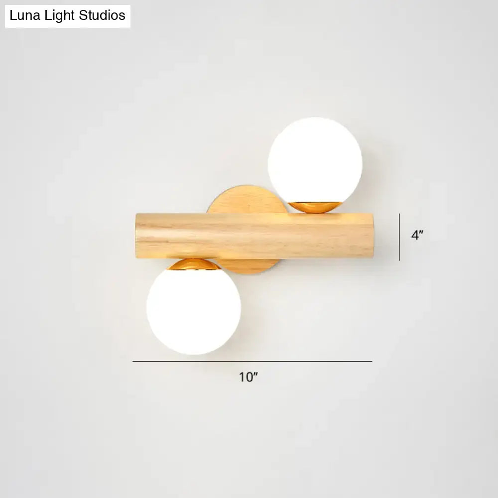 White Glass Ball Sconce by Decorbites with natural wood bar and dual globe lights on Tampa Home & Garden Store