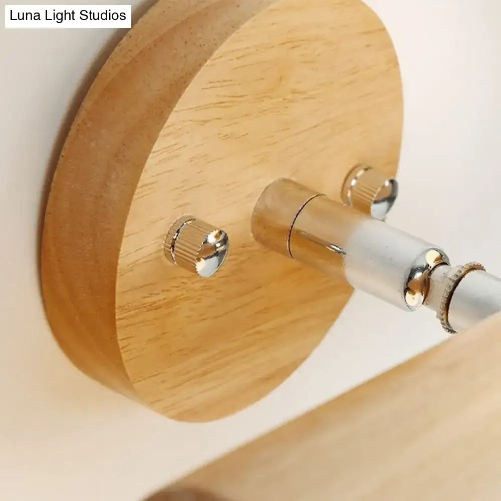 White glass ball sconce on round wood backplate with chrome hardware by Decorbites on Tampa Home & Garden Store