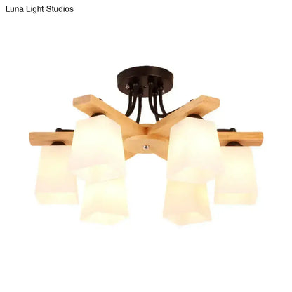 Black milk glass light fixture with wooden arms and white shades by Decorbites on Tampa Home & Garden Store