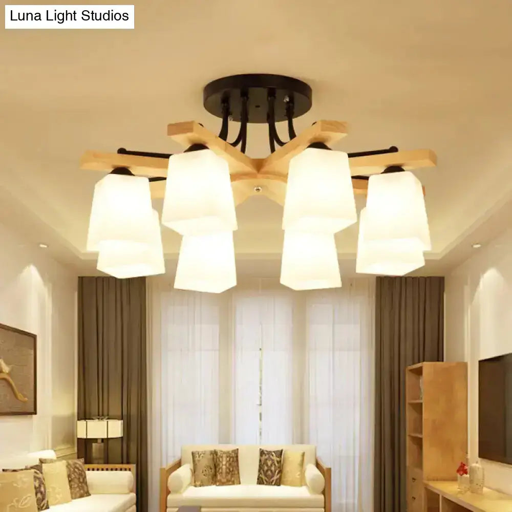 Black milk glass light fixture with six white shades on wooden arms on Tampa Home & Garden Store