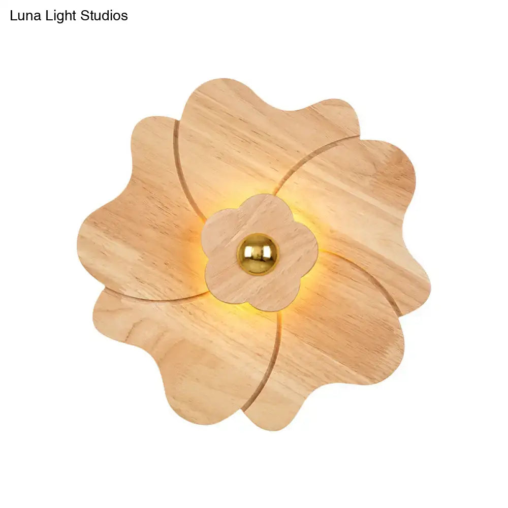 Wood Flower Wall Sconce by Decorbites, natural wood petals with warm glow and gold center on Tampa Home & Garden Store