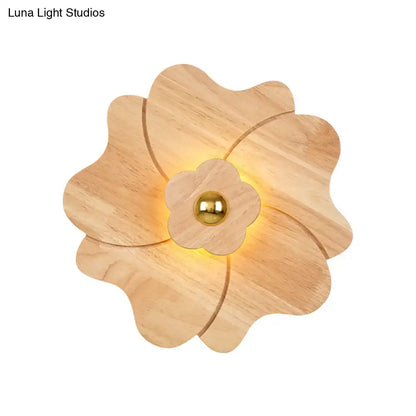 Wood Flower Wall Sconce by Decorbites, natural wood petals with warm glow and gold center on Tampa Home & Garden Store