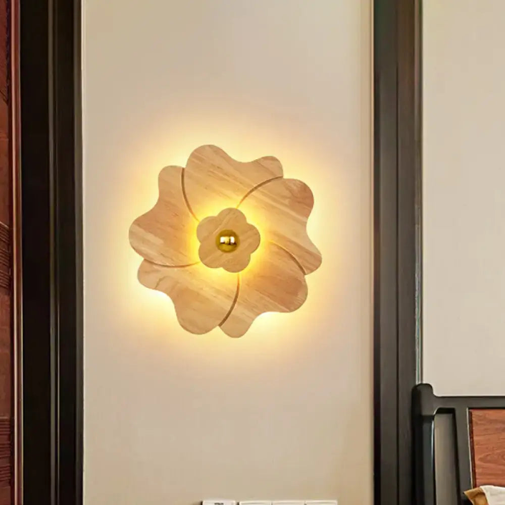 Wood Flower Wall Sconce in light wood with warm backlit glow on Tampa Home & Garden Store