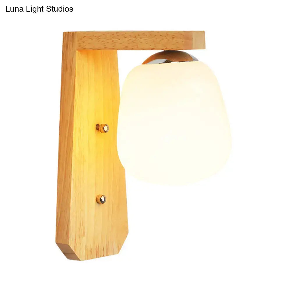 Wooden globe wall lamp with frosted glass shade and natural wood finish on Tampa Home & Garden Store