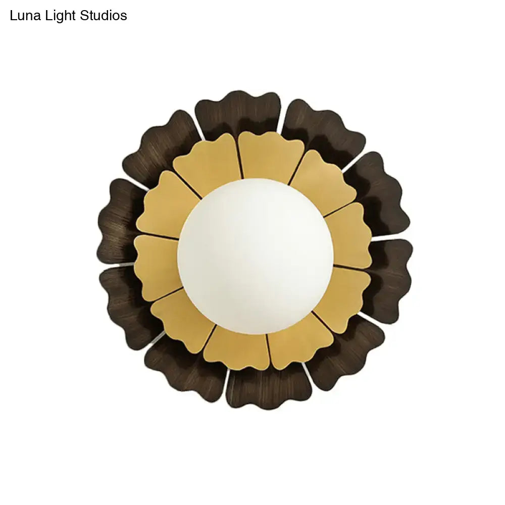 Glass Sunflower Wall Sconce with gold petals and dark outer ring, white globe by Decorbites on Tampa Home & Garden Store