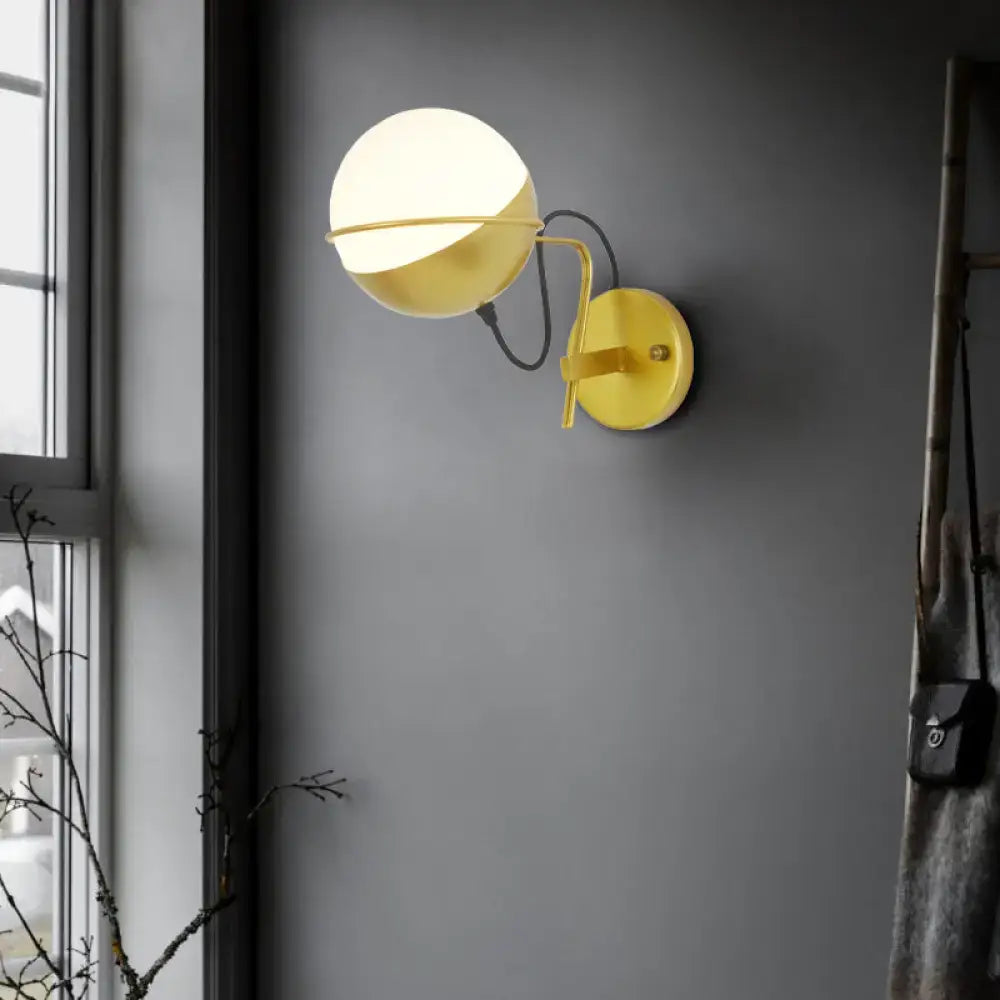 Yellow globe wall sconce by Decorbites with matte glass, industrial wall light on Tampa Home & Garden Store