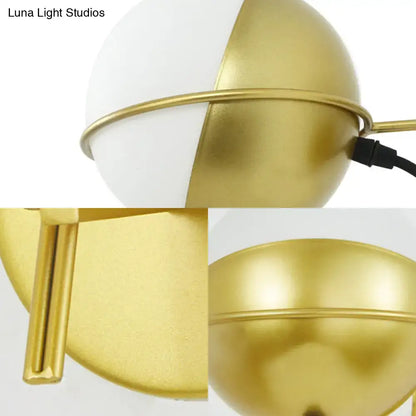 Yellow globe wall sconce, matte glass with gold brass finish, Decorbites industrial lighting on Tampa Home & Garden Store