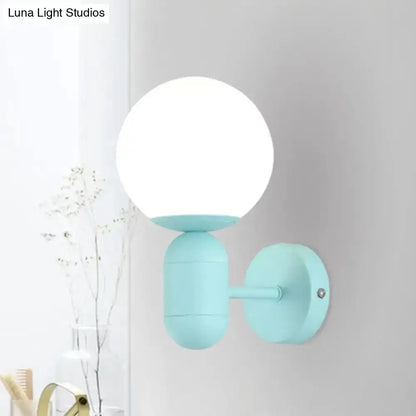 Modern Yellow Wall Lamp with Frosted Orb Shade