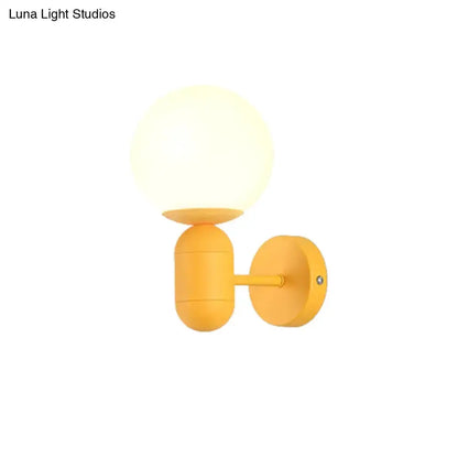 Modern Yellow Wall Lamp with Frosted Orb Shade