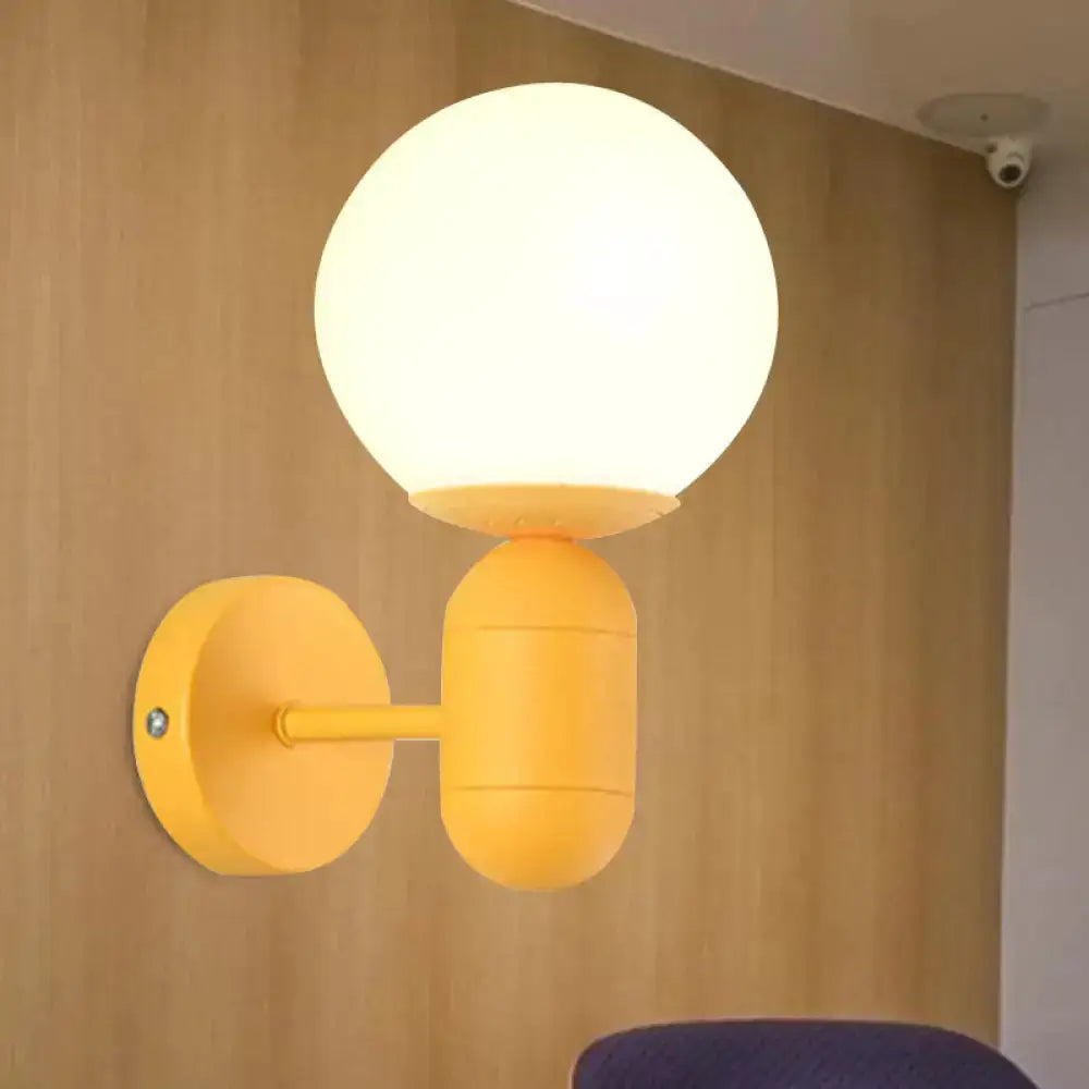 Modern Yellow Wall Lamp with Frosted Orb Shade