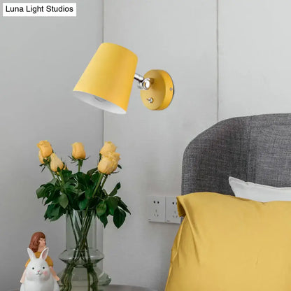 Yellow metal wall sconce light by Decorbites with yellow shade and chrome arm above bed on Tampa Home & Garden Store