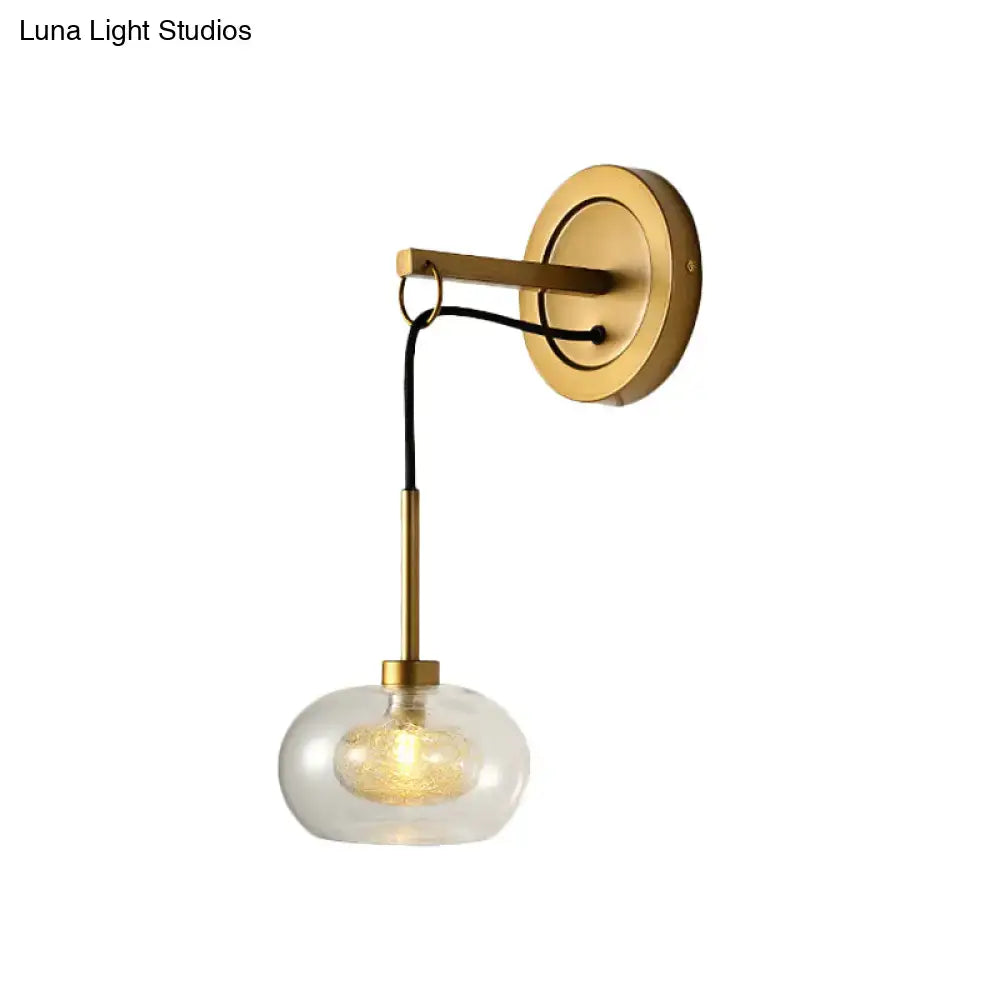 Amber White Glass Sconce with brass wall mount and clear glass globe by Decorbites on Tampa Home & Garden Store