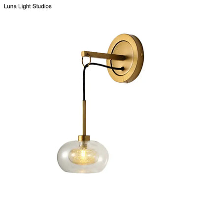 Amber White Glass Sconce with brass wall mount and clear glass globe by Decorbites on Tampa Home & Garden Store