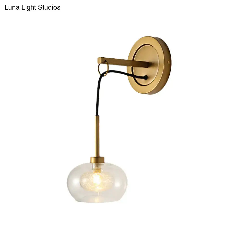Amber White Glass Sconce with brass arm, glass globe shade on Tampa Home & Garden Store
