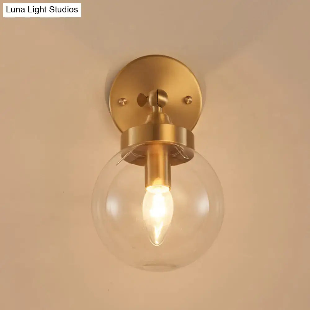Brass ball rotatable wall lamp with clear glass globe, Luna Light Studios on Tampa Home & Garden Store