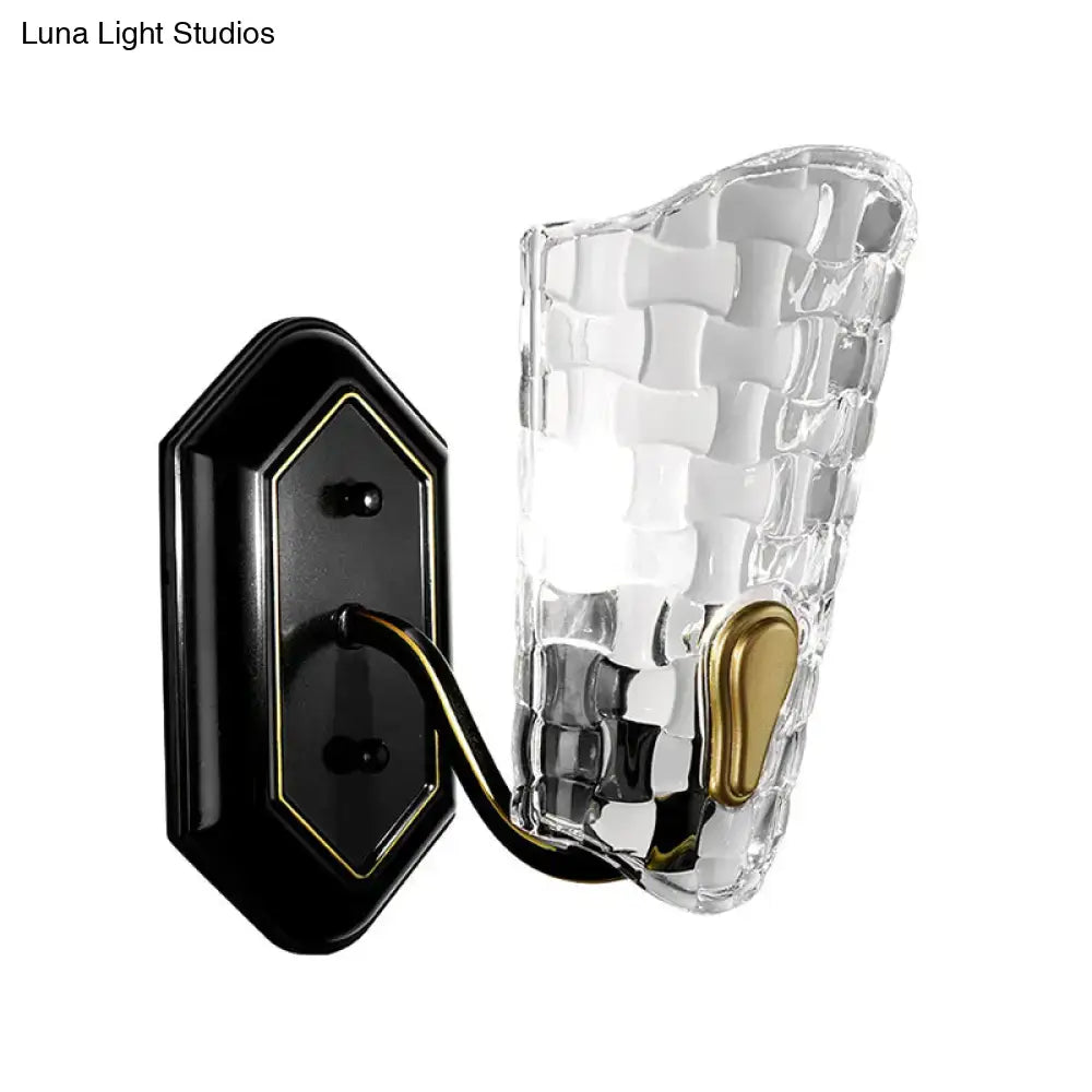 Black crystal panel wall sconce with curved arm and textured clear glass, black backplate on Tampa Home & Garden Store