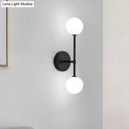 Gold Double Globe Sconce wall light by Decorbites with black mount and two white globes on Tampa Home & Garden Store