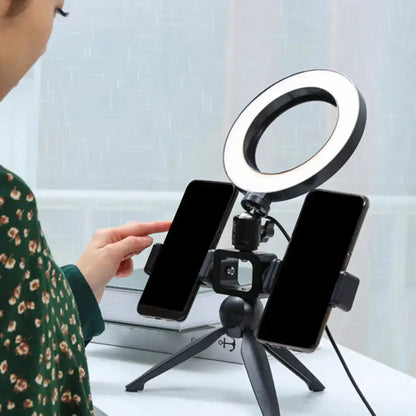 Black LED phone mount ring light by Decorbites on a small tripod holding two smartphones on Tampa Home & Garden Store