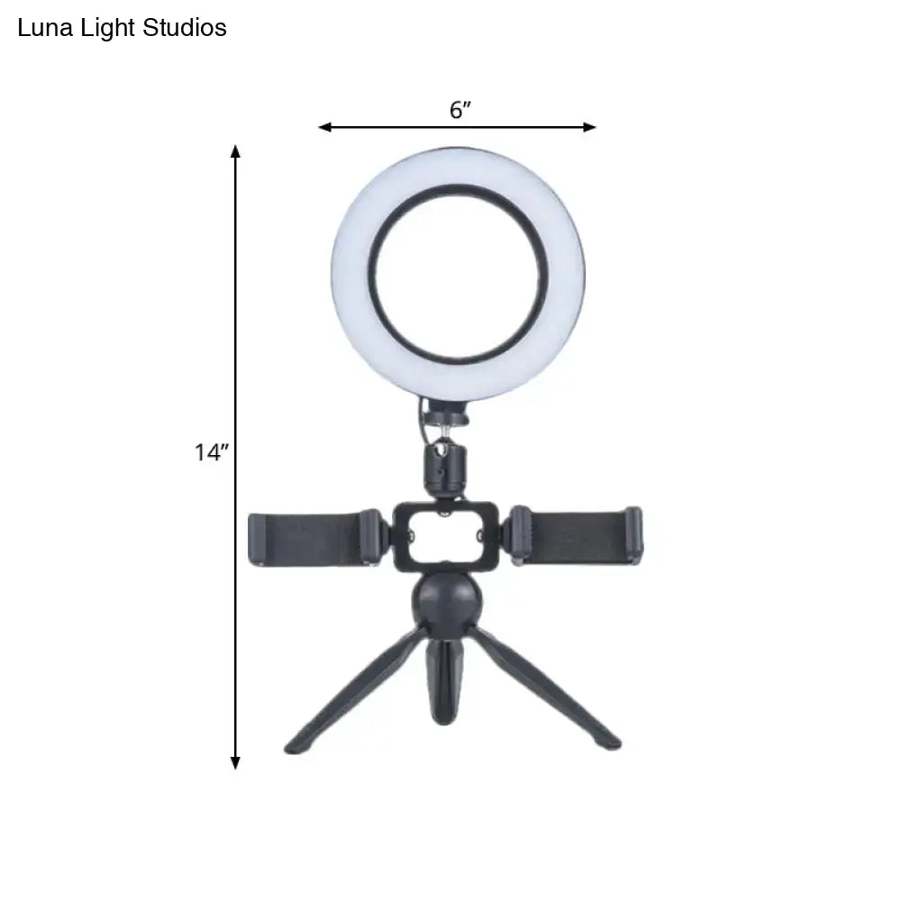 Black LED phone mount ring light on a compact tripod with adjustable smartphone clamps on Tampa Home & Garden Store