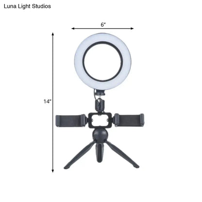Black LED phone mount ring light on a compact tripod with adjustable smartphone clamps on Tampa Home & Garden Store