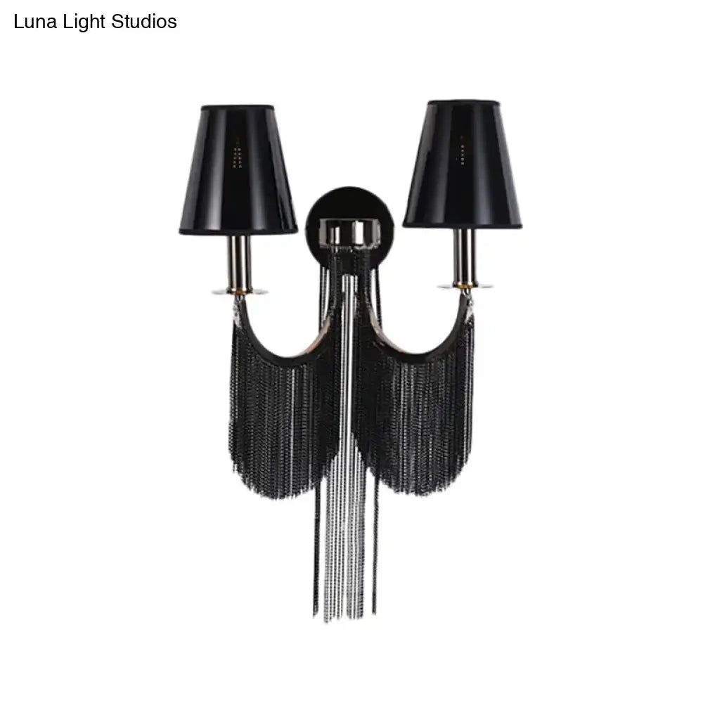 Black tassel sconce by Decorbites with twin black shade lamps and long fringe on Tampa Home & Garden Store