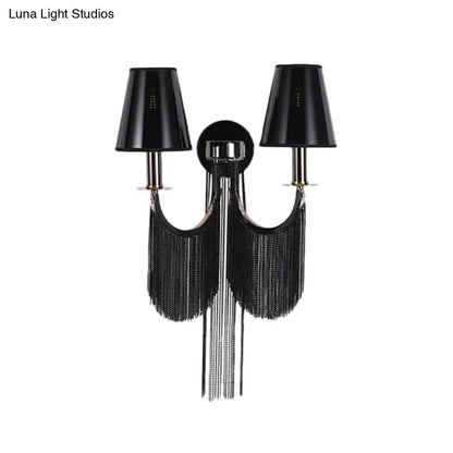 Black tassel sconce by Decorbites with twin black shade lamps and long fringe on Tampa Home & Garden Store