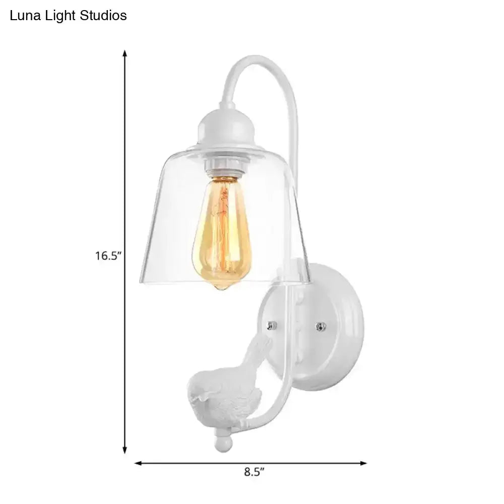 White metal wall sconce with glass cone shade and Edison bulb bird motif on Tampa Home & Garden Store