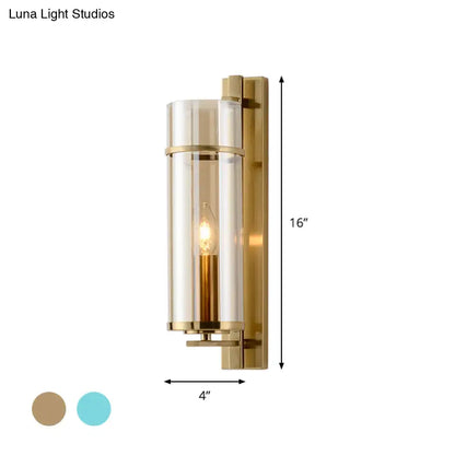 Brass water blue glass sconce with cylindrical shade and backplate by Decorbites on Tampa Home & Garden Store