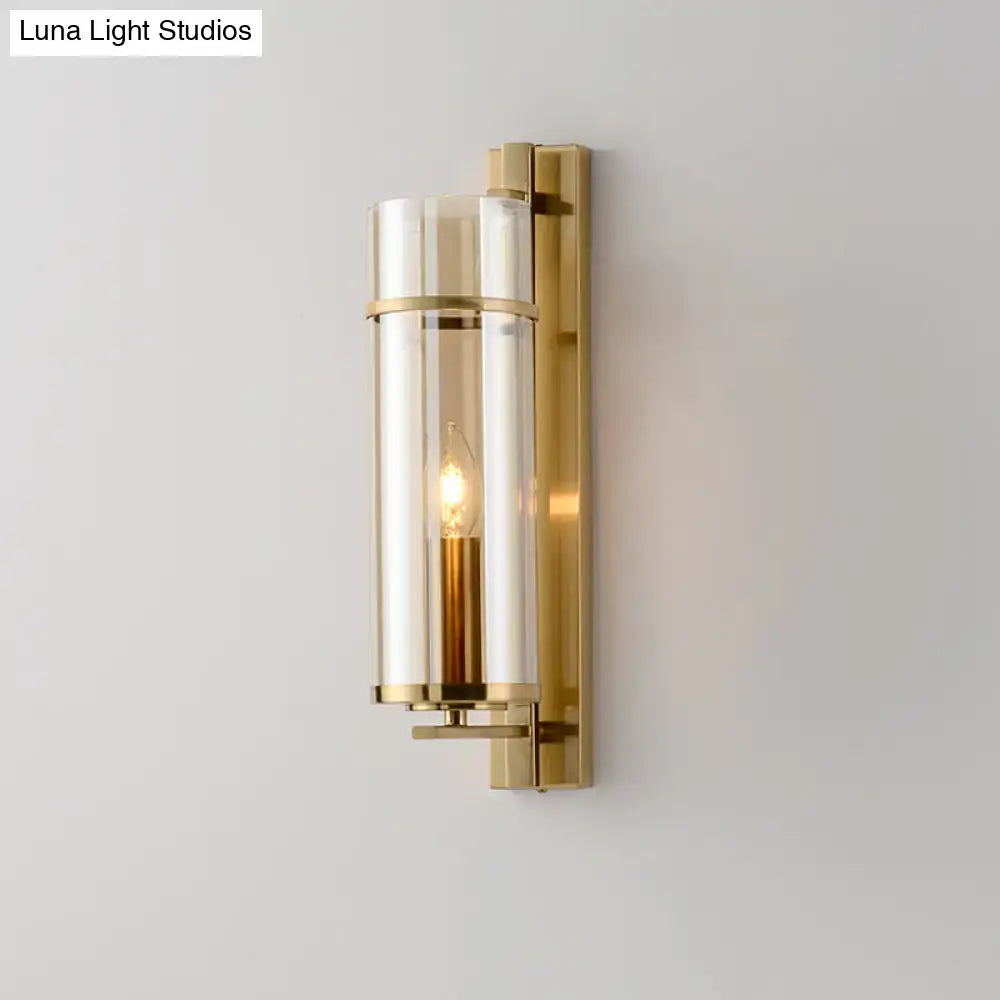 Brass water-blue glass wall sconce with glass tubes around a candle bulb by Decorbites on Tampa Home & Garden Store