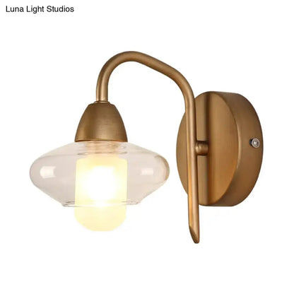 Brass clear wall lamp by Decorbites with curved arm and glass shade wall sconce on Tampa Home & Garden Store