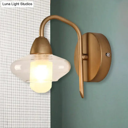 Brass wall lamp with clear glass shade and curved arm sconce Decorbites on Tampa Home & Garden Store