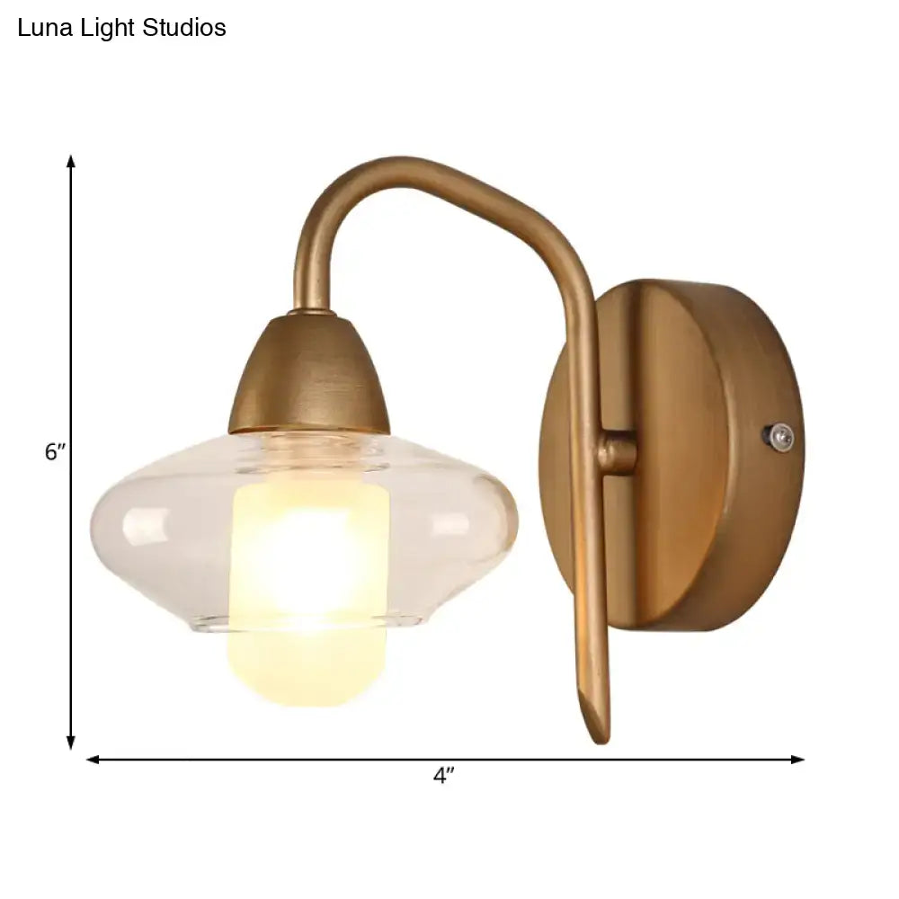 Brass Clear Wall Lamp by Decorbites with curved arm and clear glass shade 6in tall 4in wide on Tampa Home & Garden Store