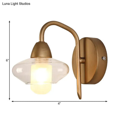 Brass Clear Wall Lamp by Decorbites with curved arm and clear glass shade 6in tall 4in wide on Tampa Home & Garden Store