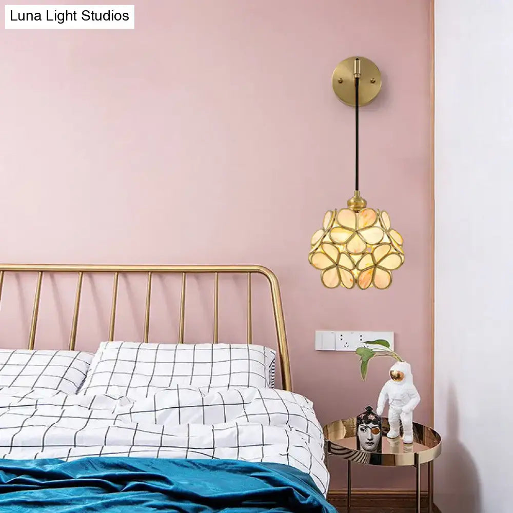 Brass floral glass sconce by Decorbites; gold petal shade, round backplate on Tampa Home & Garden Store