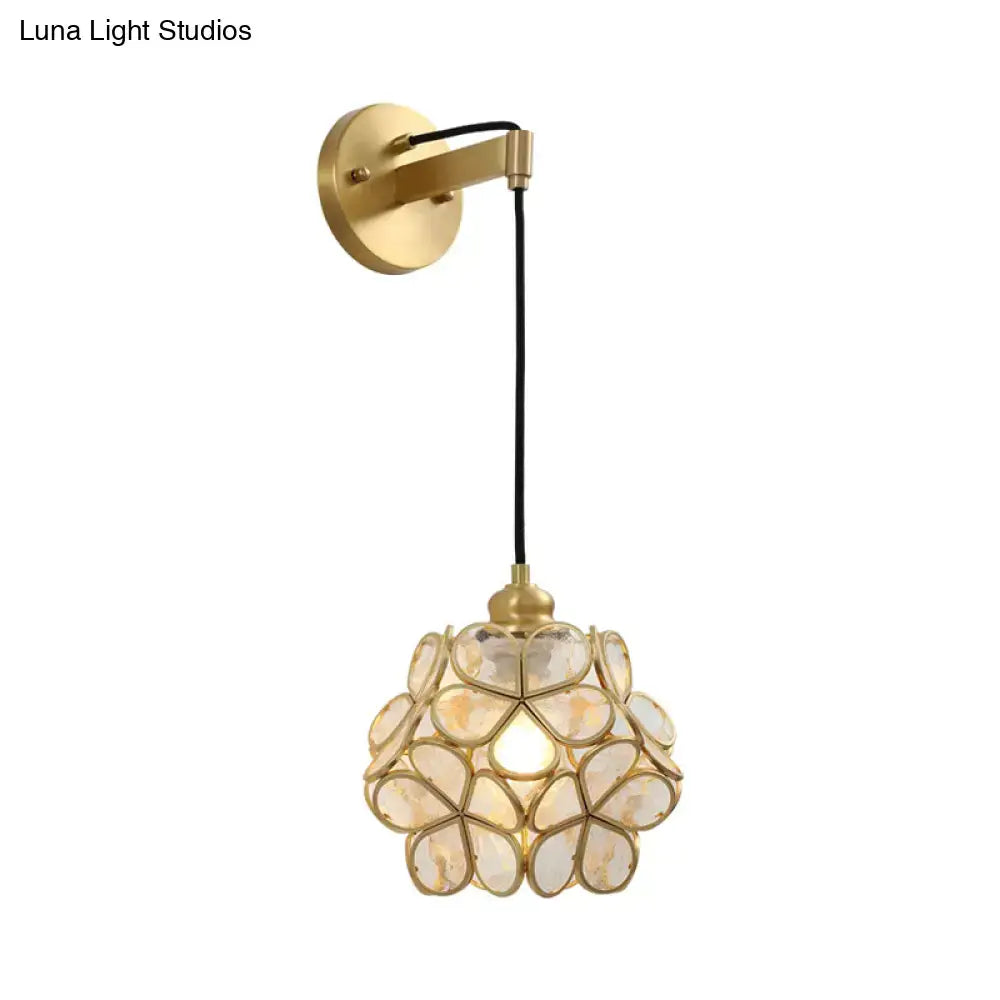 Brass floral glass sconce with petal-shaped glass shade and wall mount, black cord on Tampa Home & Garden Store