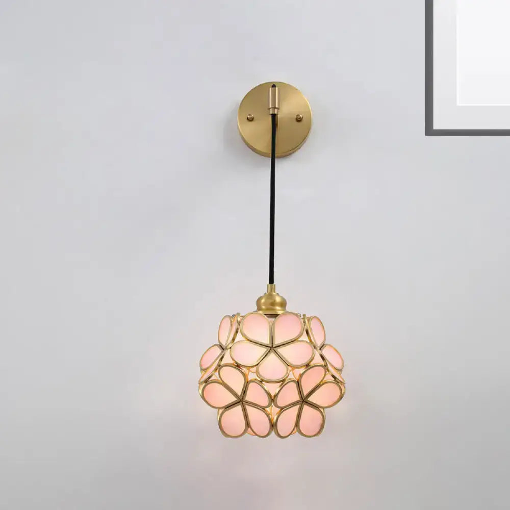 Brass floral glass sconce with pink petal shade and round backplate on black cord on Tampa Home & Garden Store