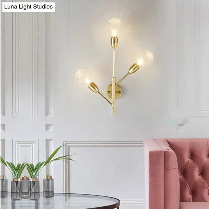 Brass wall mount light fixture with 3 arms and prismatic glass bulbs for a modern bedroom on Tampa Home & Garden Store