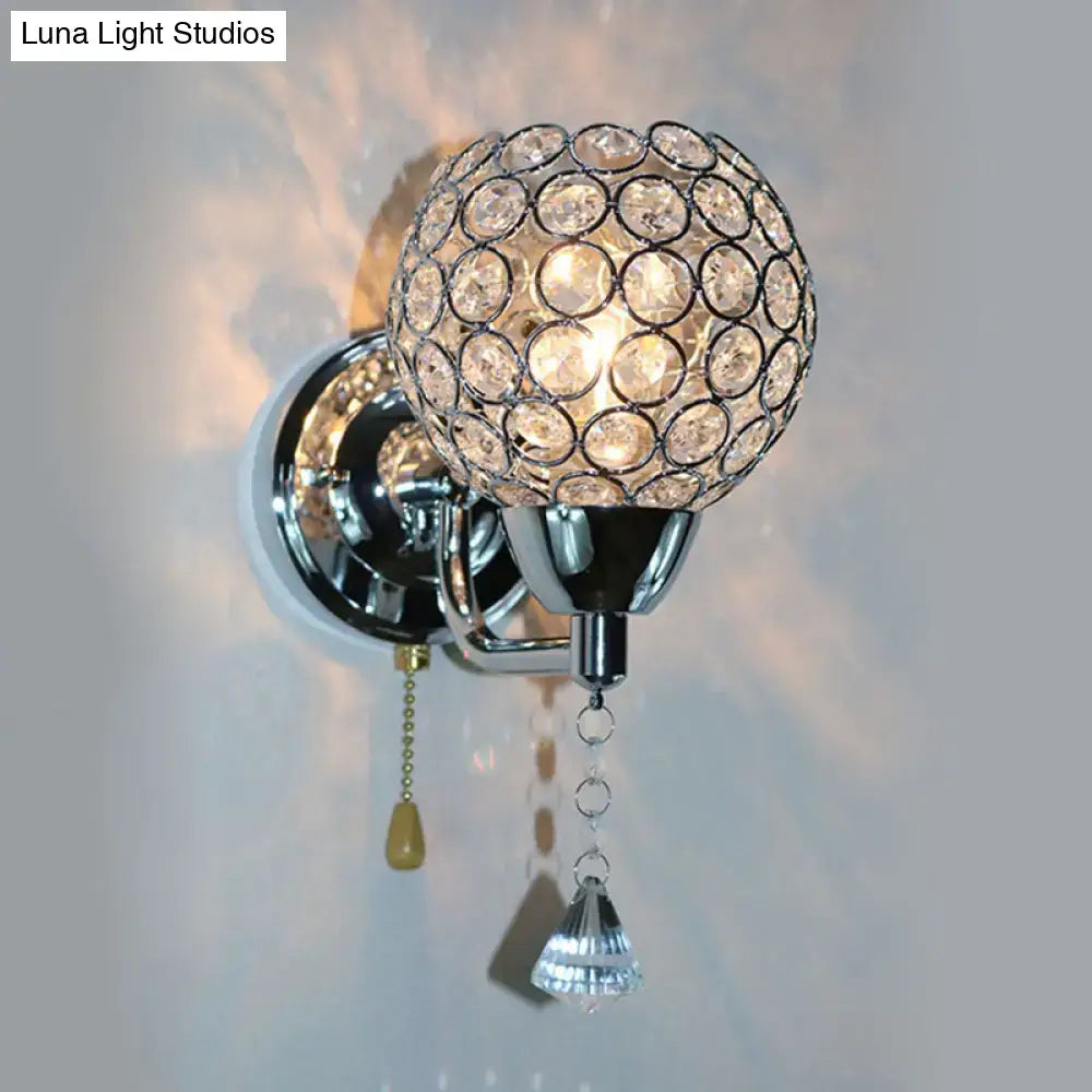 Chrome crystal metal frame wall light sconce with a glass orb and hanging prisms by Decorbites on Tampa Home & Garden Store