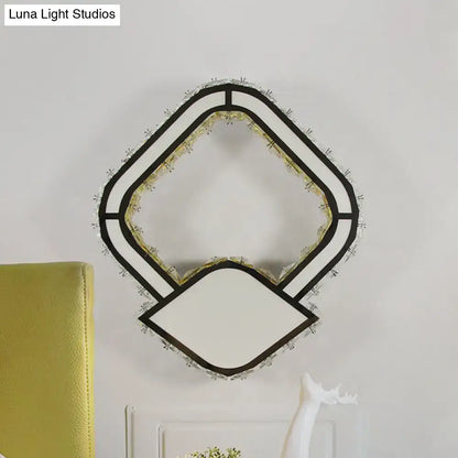Crystal LED Wall Sconce by Decorbites with geometric black frame and crystal fringe on Tampa Home & Garden Store