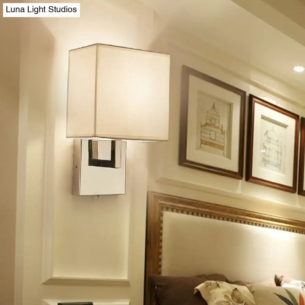 Beige gold wall sconce by Decorbites with square shade and chrome backplate on bedroom wall on Tampa Home & Garden Store