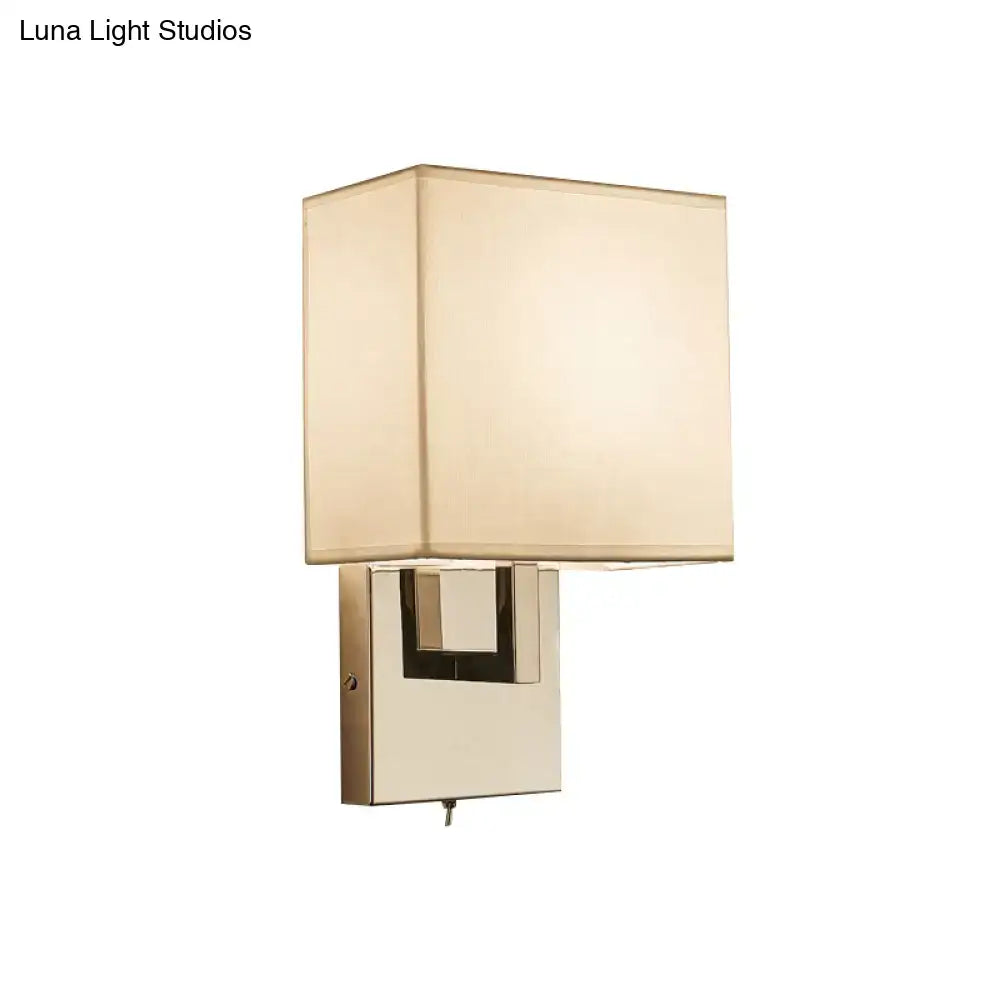 Beige gold wall sconce with square fabric shade and polished brass base on Tampa Home & Garden Store