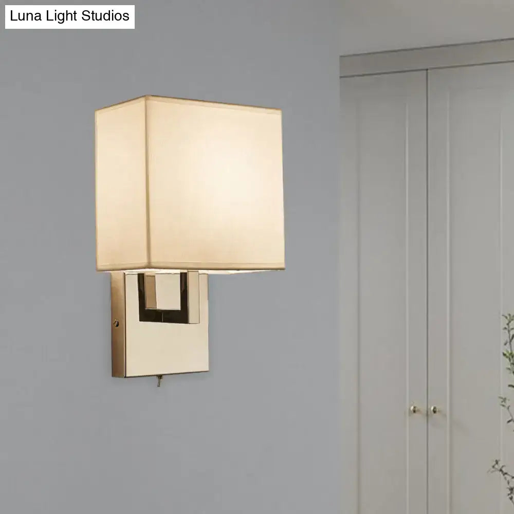 Decorbites beige gold wall sconce with square fabric shade and gold metal backplate on Tampa Home & Garden Store
