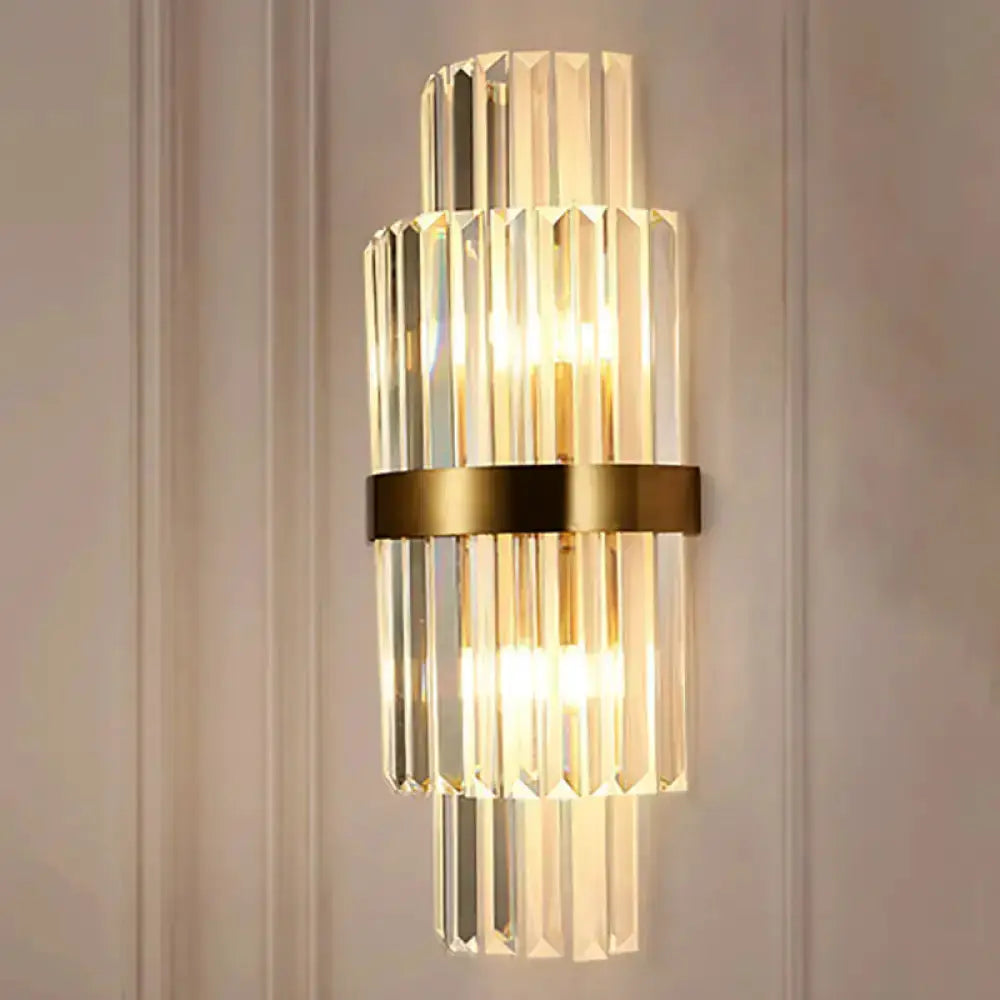 Modernist gold and clear crystal cylinder wall light with brass band on Tampa Home & Garden Store